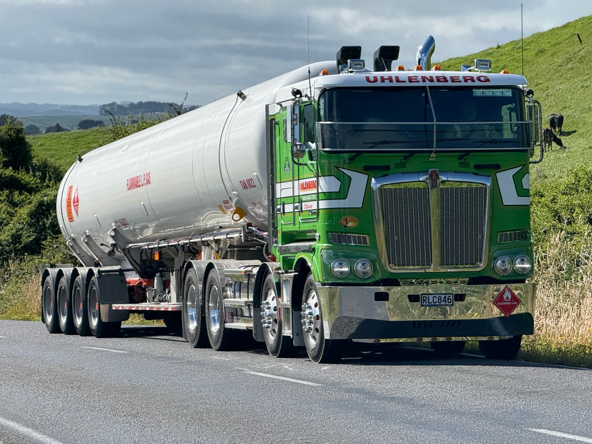 Green Uhlenberg LPG tanker travelling on a rural New Zealand road